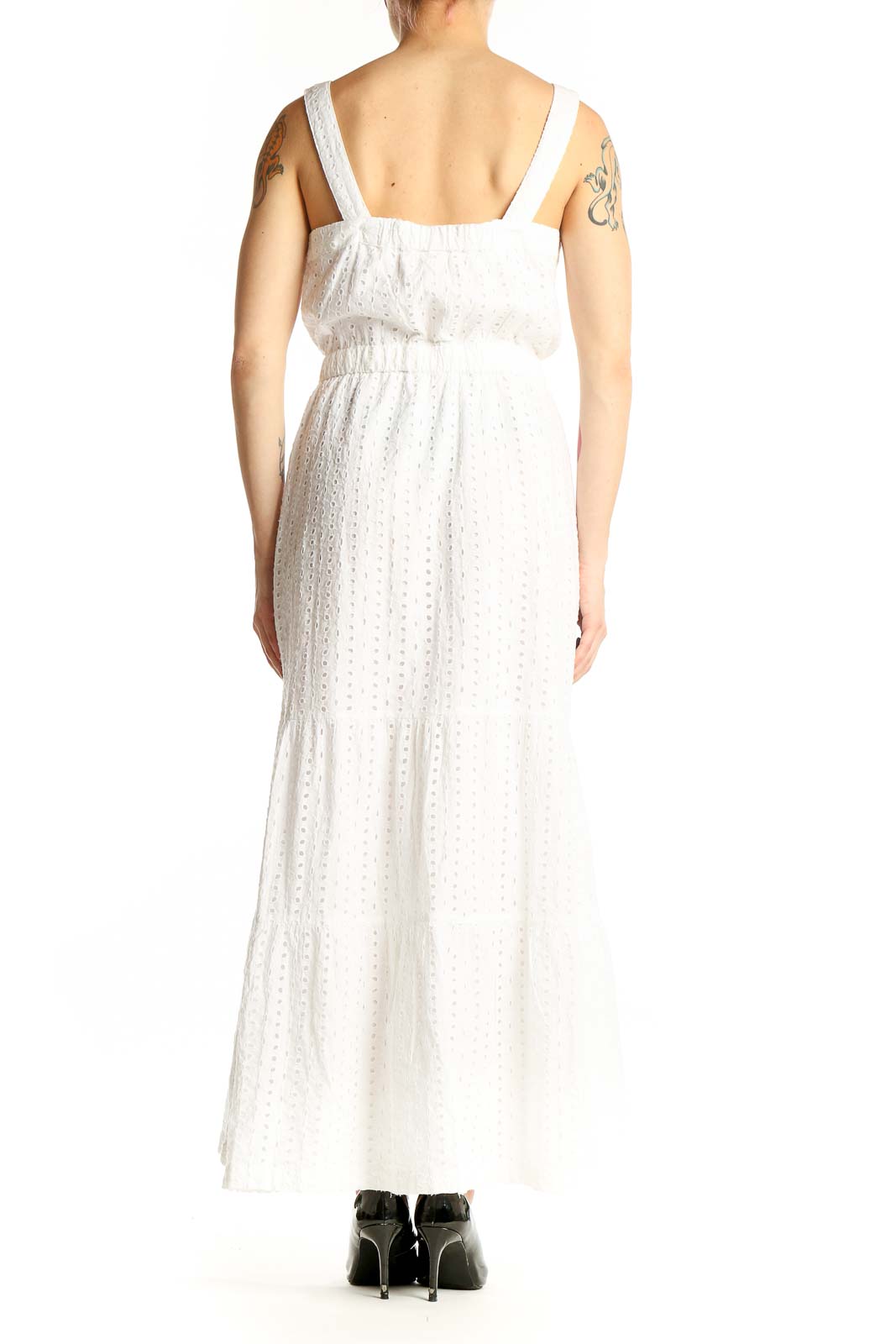 Side view of Gap white cotton eyelet maxi dress showing flowing tiered skirt