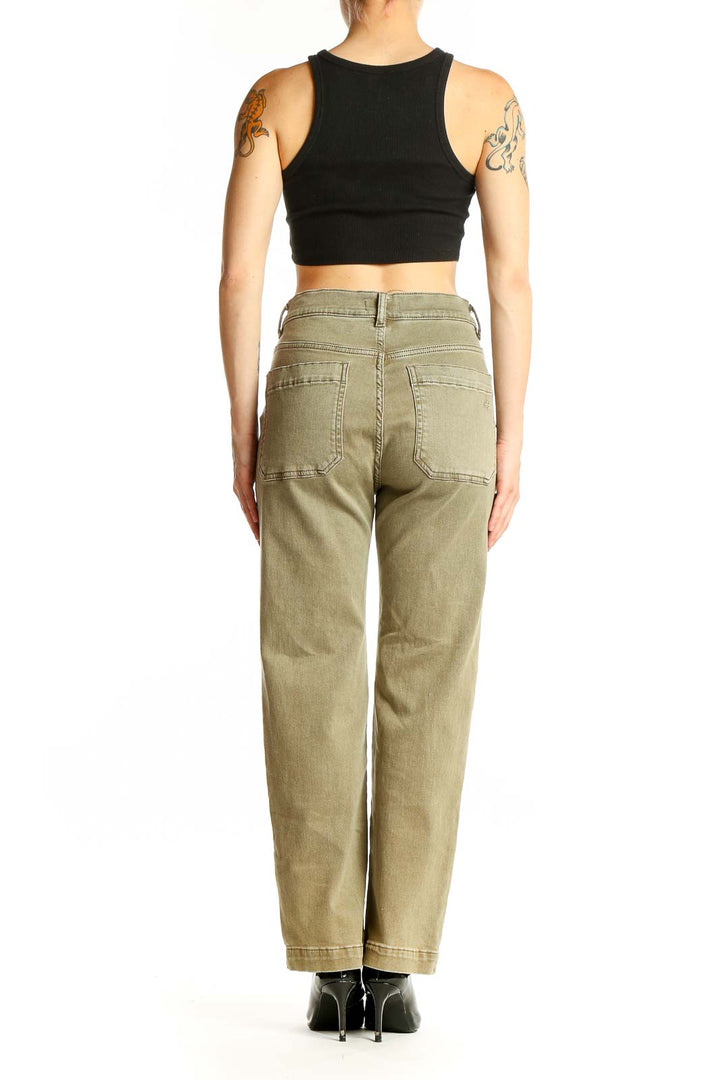 Side view of woman wearing DL1961 olive high-waisted wide-leg denim pants