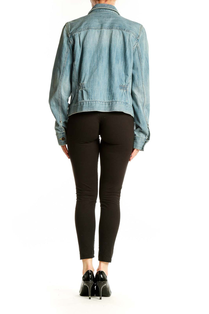 Back view of Lauren Jeans Co. Ralph Lauren light blue denim jacket showing fit and length