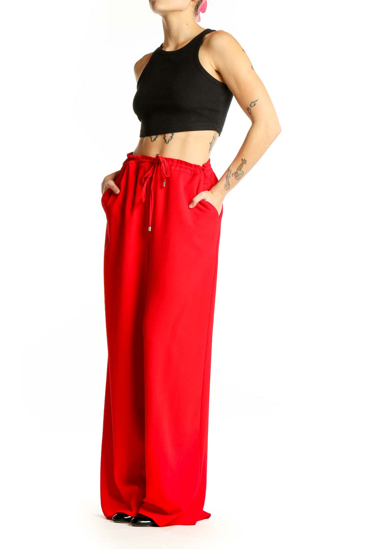 Front view of red DKNY wide-leg pants with drawstring waist