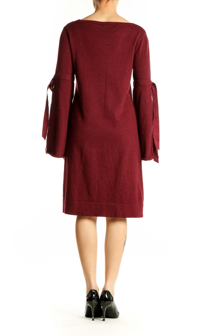 Side view of Max Studio burgundy knit dress showing bell sleeve detail