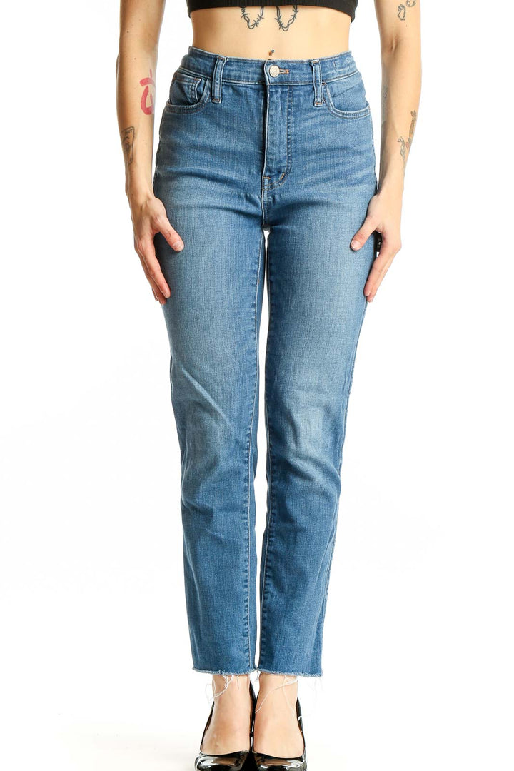 Front view of Madewell blue high-rise straight-leg jeans on model