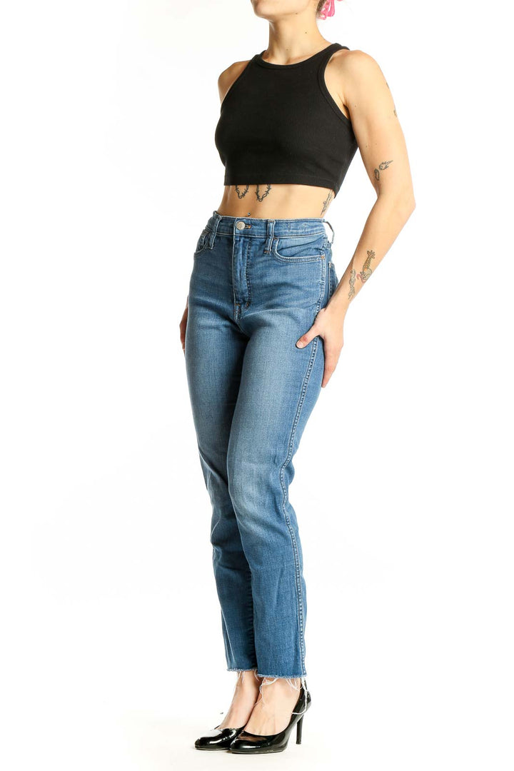 Front view of Madewell blue high-rise straight-leg jeans on model