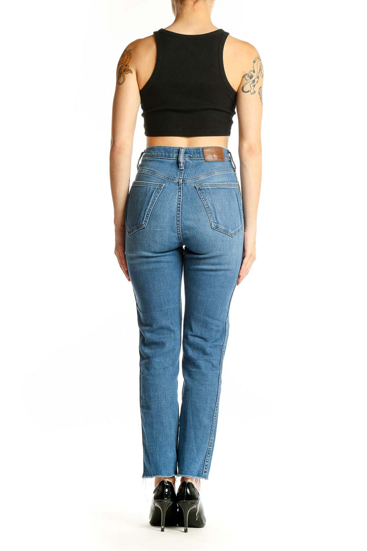 Back view of Madewell blue high-rise straight-leg jeans on model