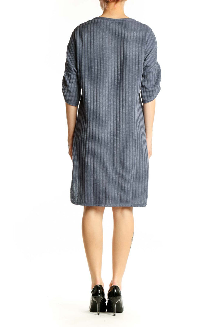 Side view of Max Studio gray ribbed knit dress showing texture and length