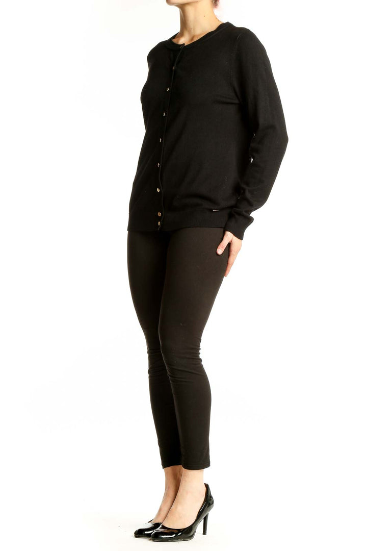 Front view of black Calvin Klein button-up cardigan
