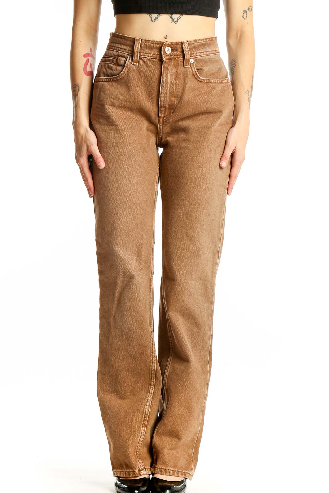 Front view of WE THE FREE tan high-waisted straight leg jeans on model