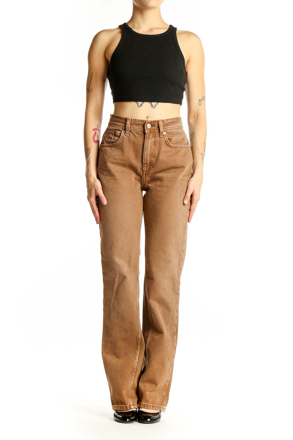 Front view of WE THE FREE tan high-waisted straight leg jeans on model