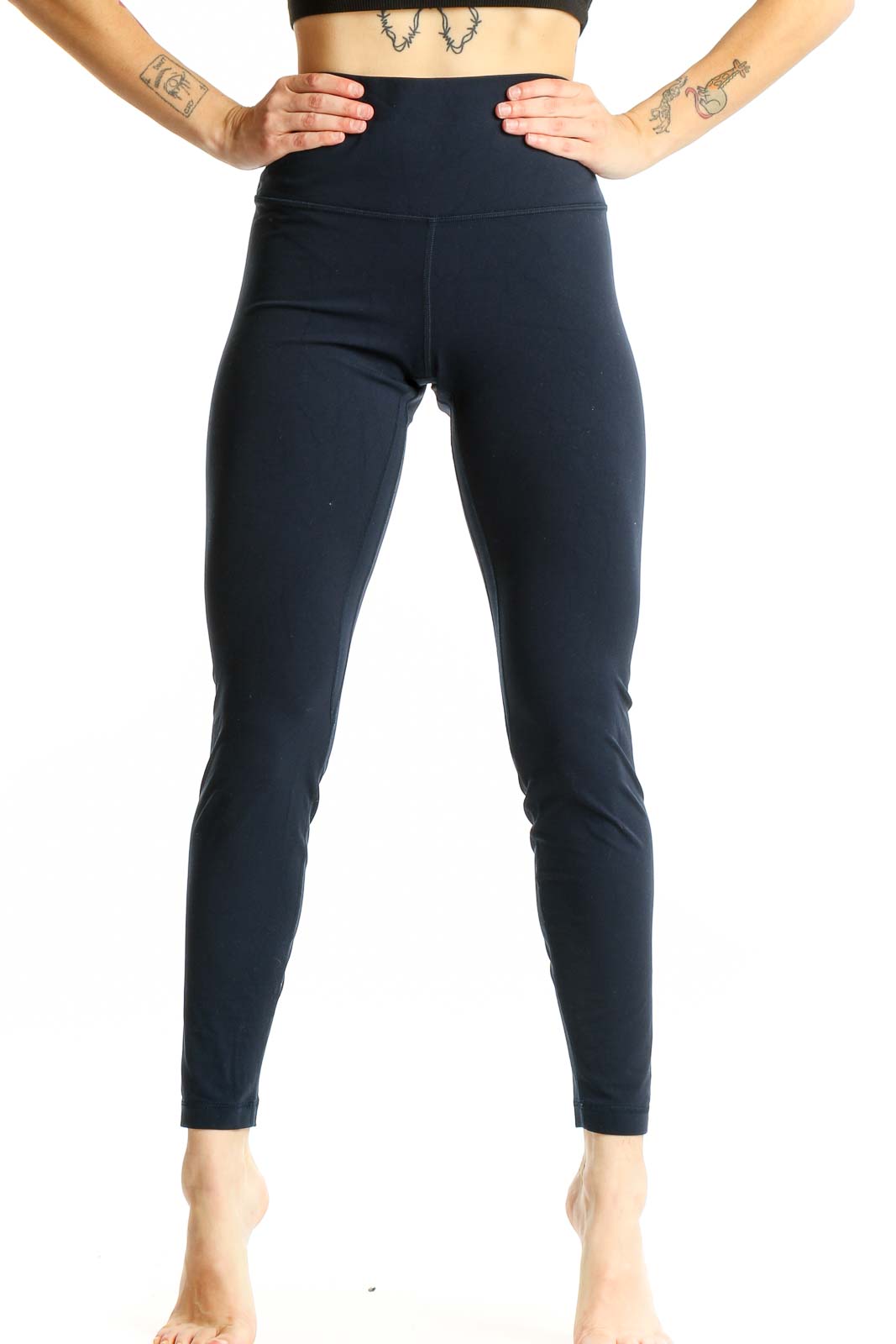 Front view of Lululemon navy high-waisted leggings on model
