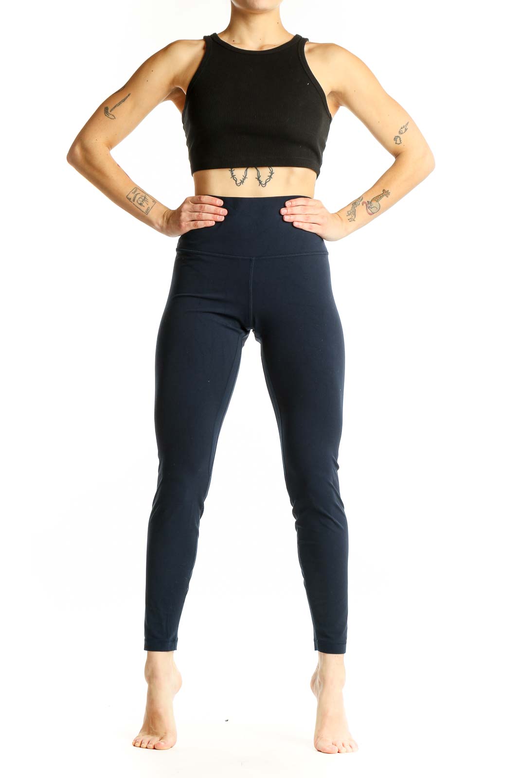 Front view of Lululemon navy high-waisted leggings on model