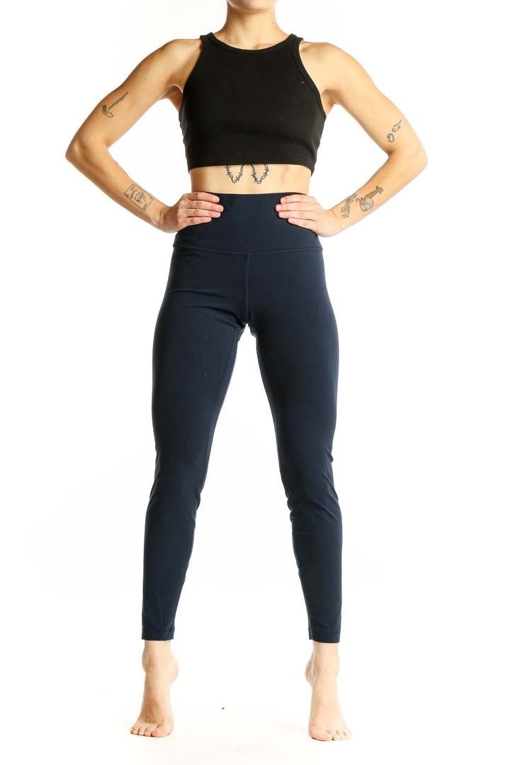Front view of Lululemon navy high-waisted leggings on model