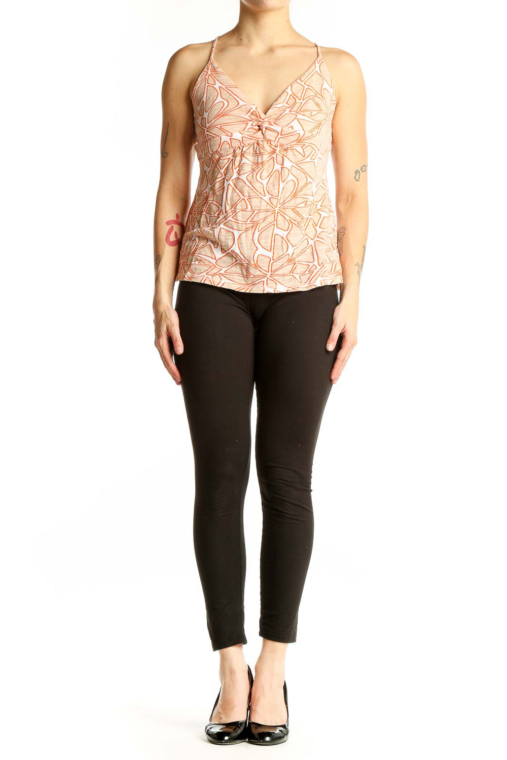 Front view of Roxy peach floral print cami top with V-neck and bow detail