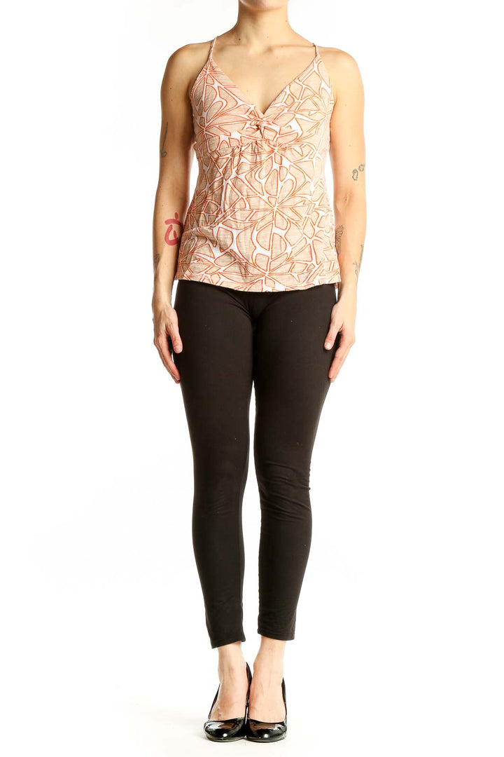 Front view of Roxy peach floral print cami top with V-neck and bow detail