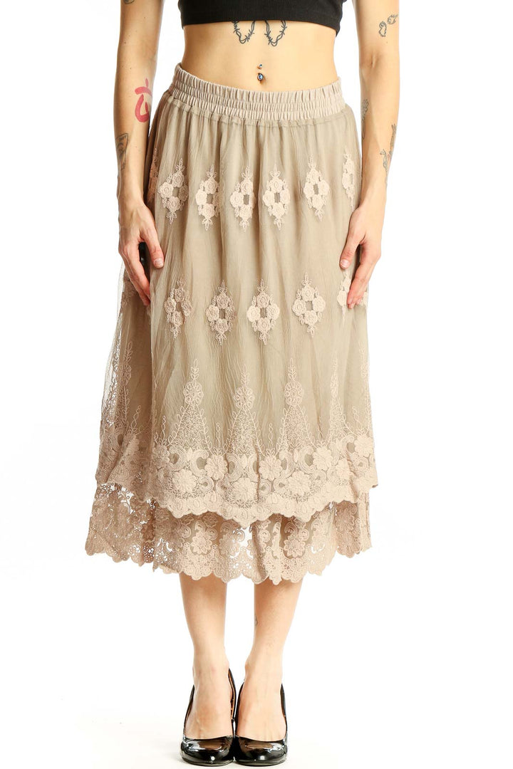 Front view of Indigo Soul beige lace embroidered midi skirt with floral pattern