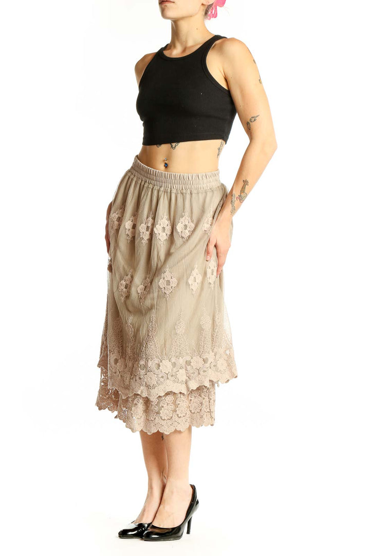 Front view of Indigo Soul beige lace embroidered midi skirt with floral pattern