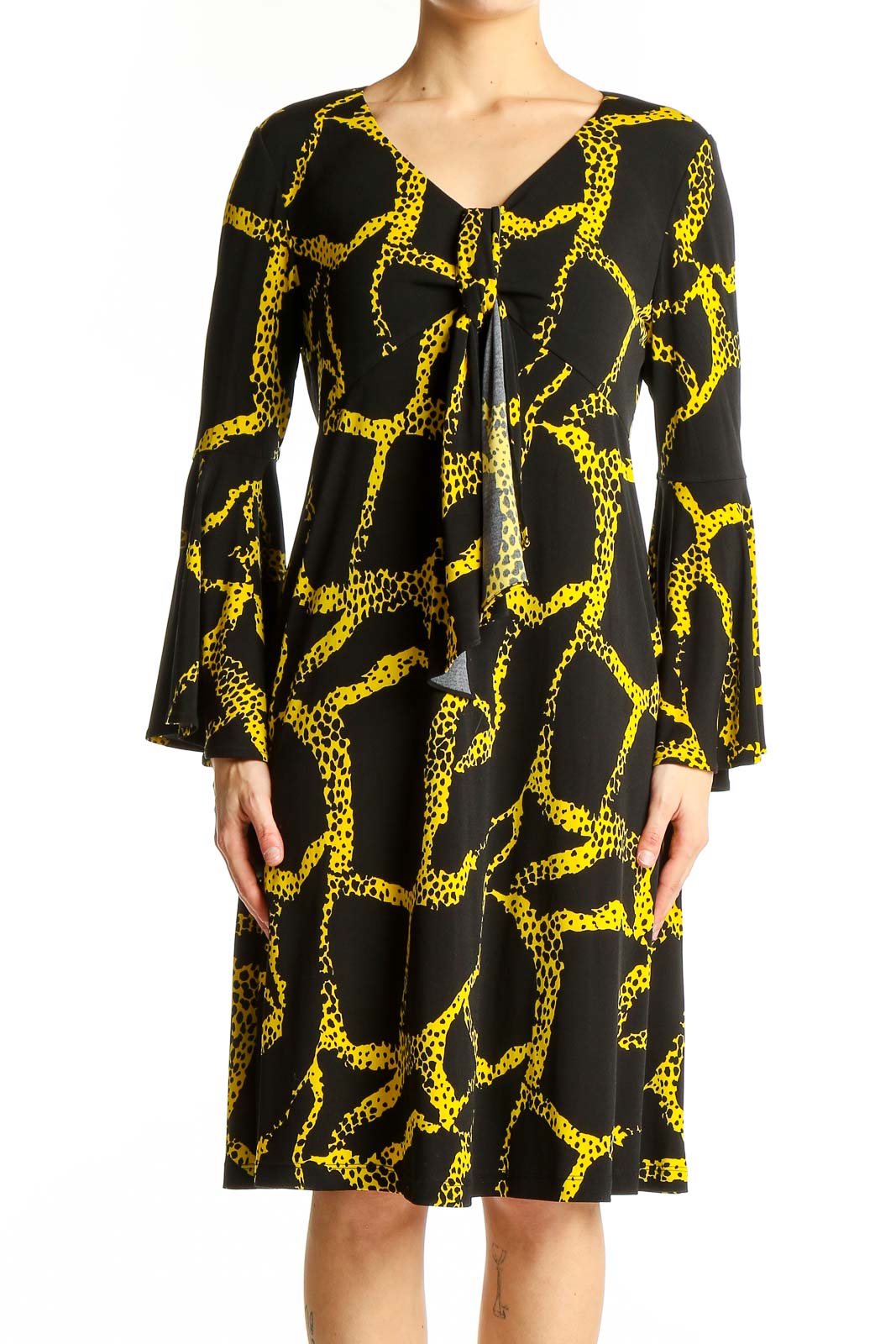 Front view of Vicky Tiel Black and Yellow Giraffe Print Dress with V-neckline and bell sleeves