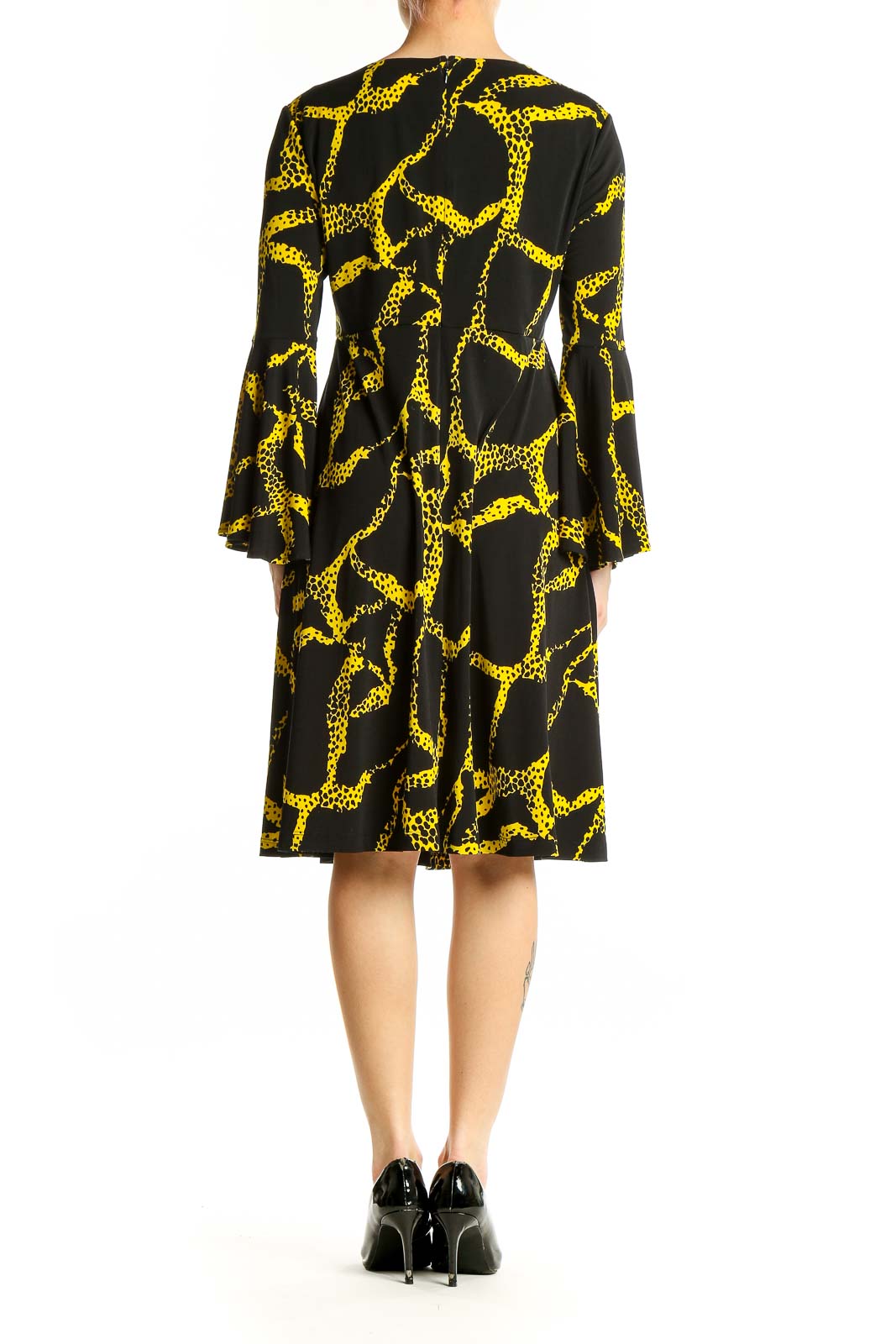Side view of Vicky Tiel Black and Yellow Giraffe Print Dress showing pattern and silhouette