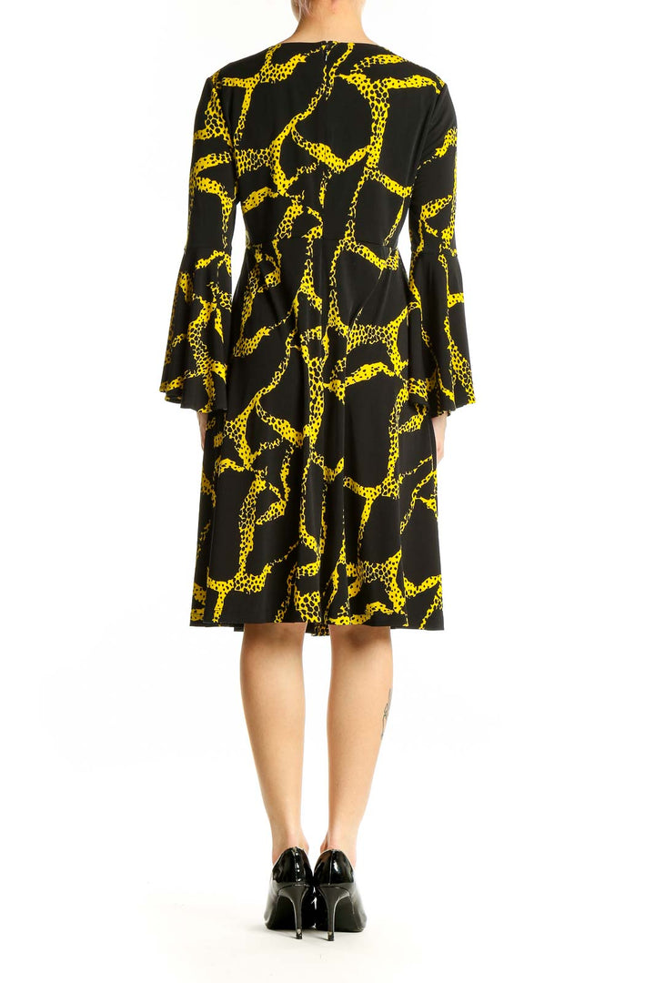 Side view of Vicky Tiel Black and Yellow Giraffe Print Dress showing pattern and silhouette
