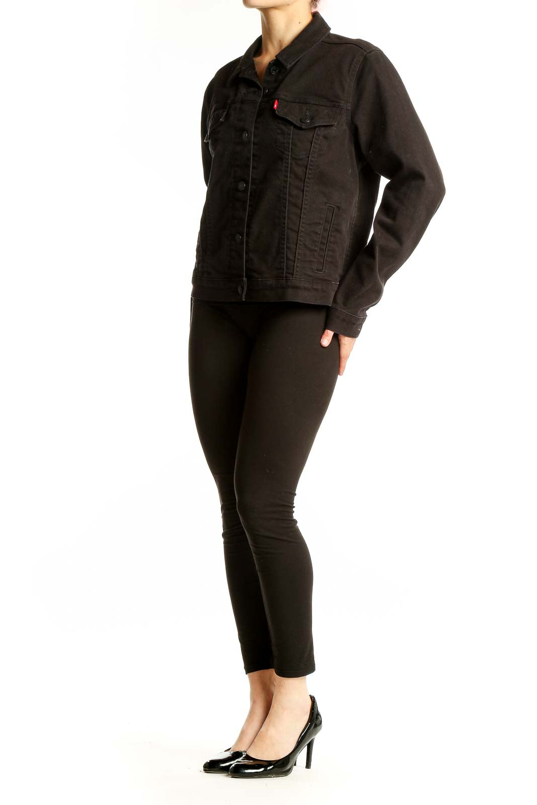 Front view of black Levi's denim jacket with button-up closure and chest pockets
