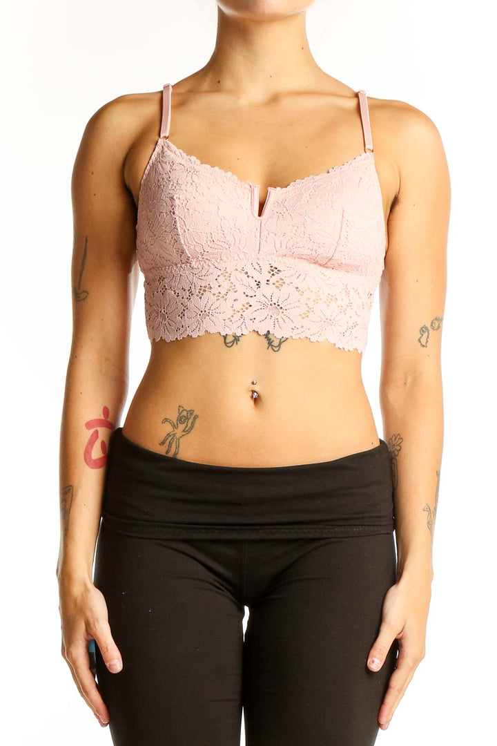 Front view of Pink Victoria's Secret lace crop top bralette in light pink