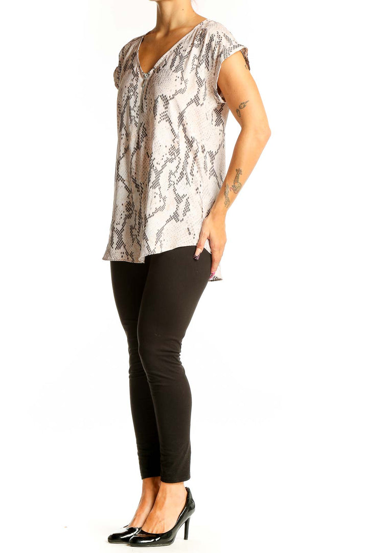 Front view of beige snake print V-neck blouse from Express