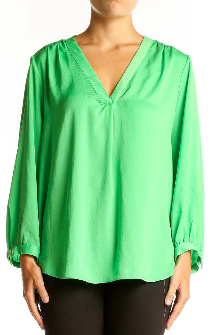 Front view of Vince Camuto green V-neck polyester blouse