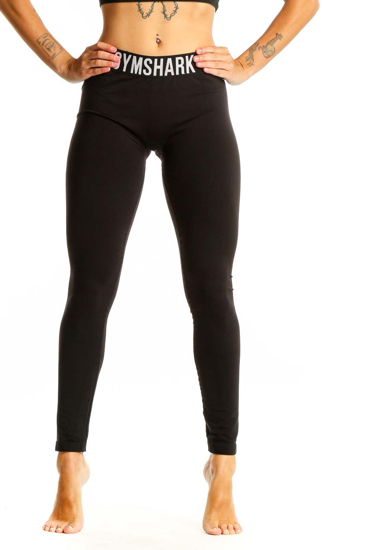 Front view of black Gymshark high-waisted leggings on female model