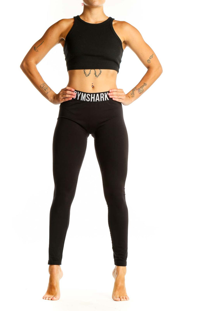 Front view of black Gymshark high-waisted leggings on female model