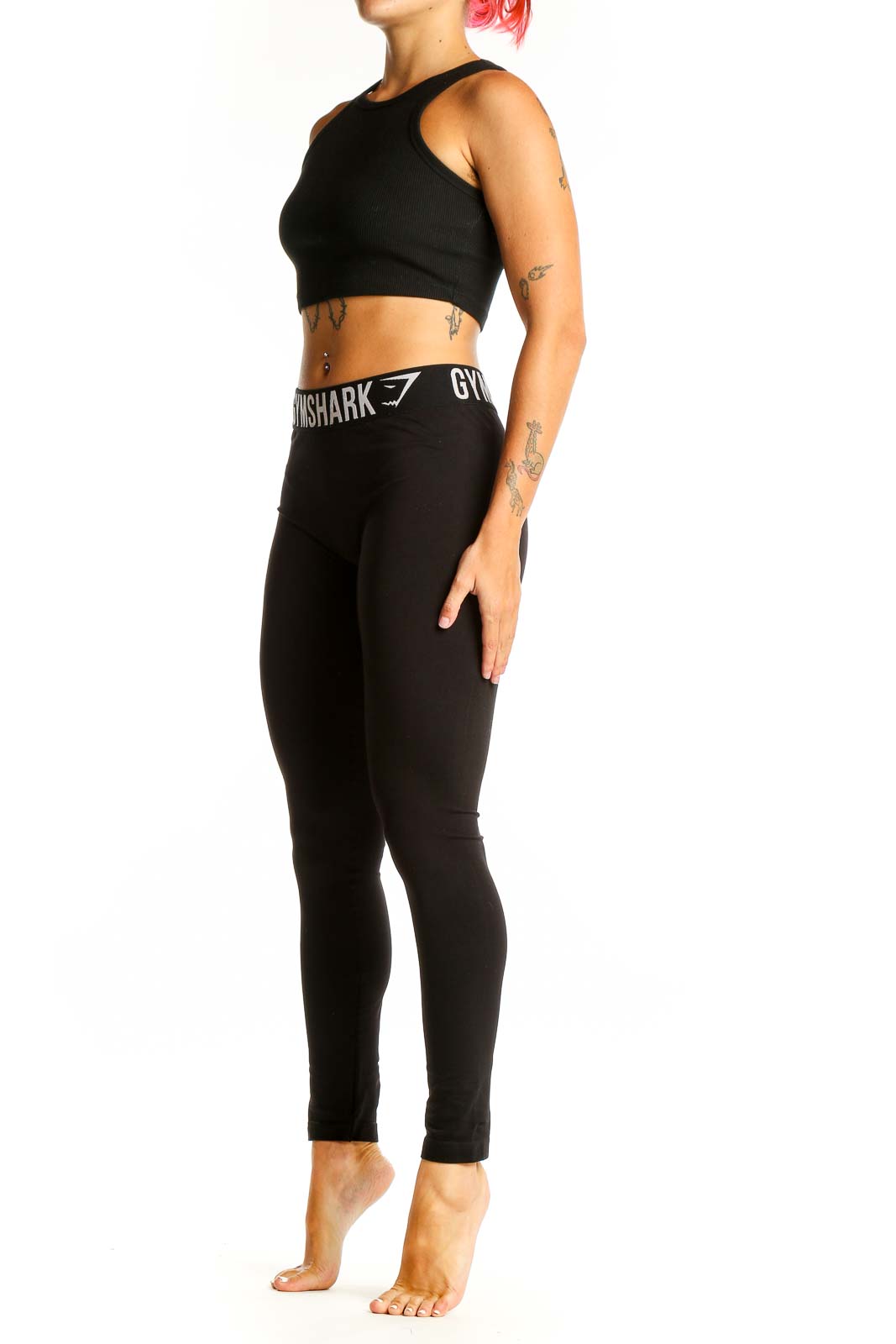 Front view of black Gymshark high-waisted leggings on female model