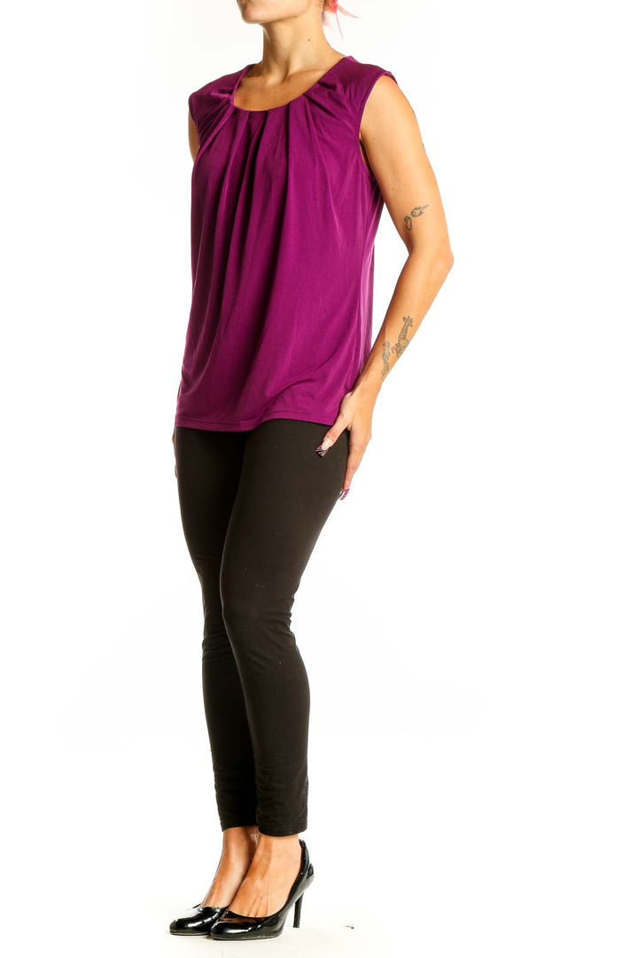 Front view of purple sleeveless blouse with pleated neckline