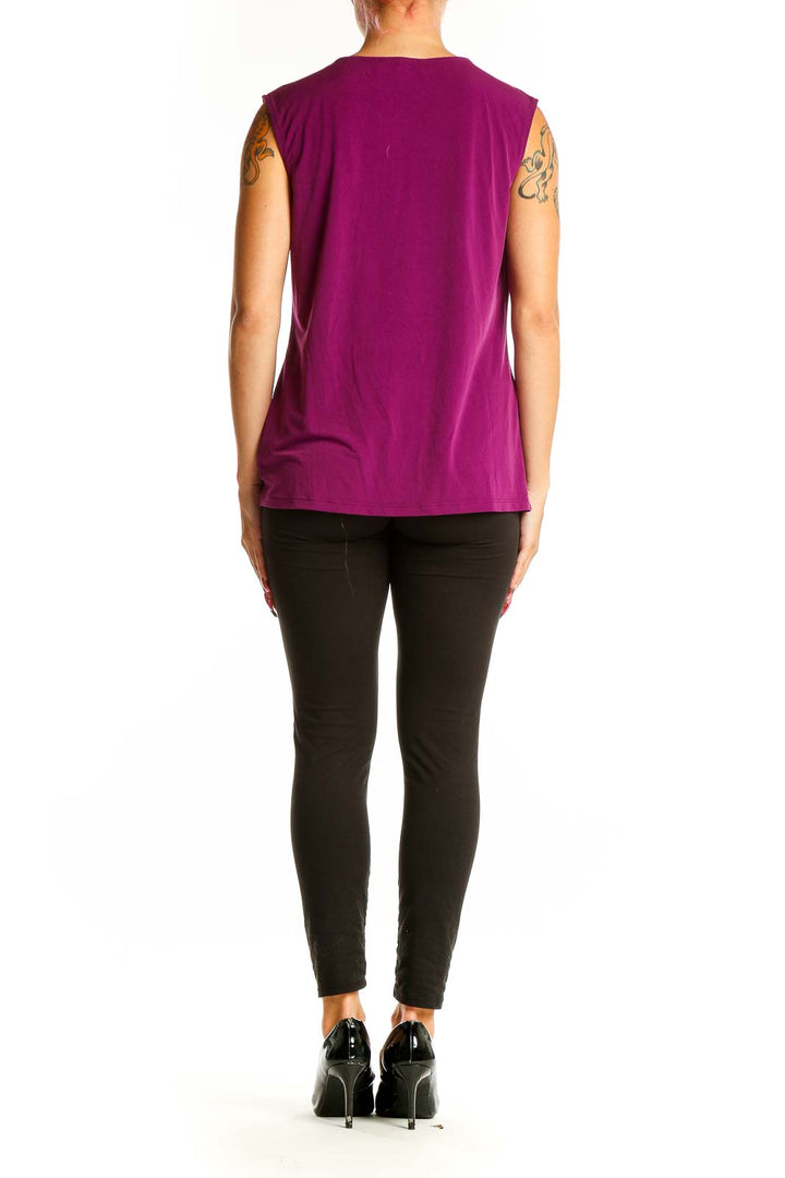 Side view of purple sleeveless blouse showing drape and fit