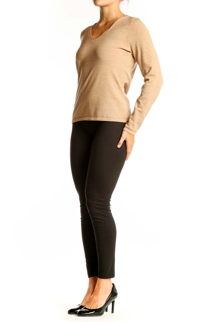 Front view of Ann Taylor beige V-neck long sleeve knit top