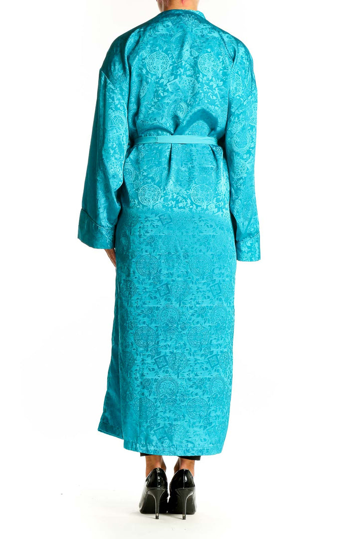 Back view of teal floral jacquard robe dress showing wrap style and tie waist