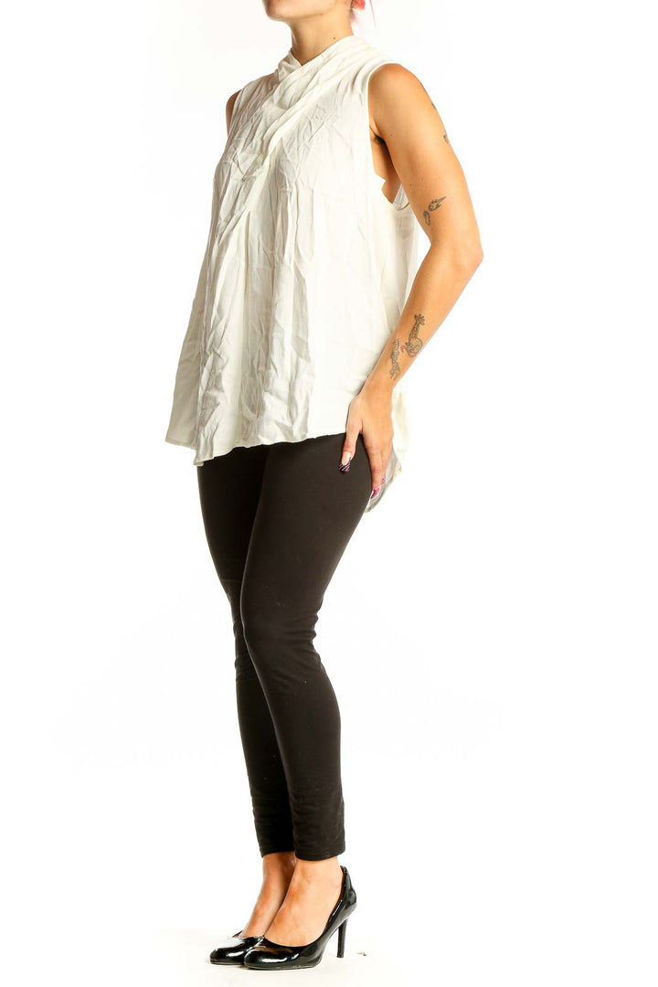 Front view of white sleeveless Maeve top with draped neckline
