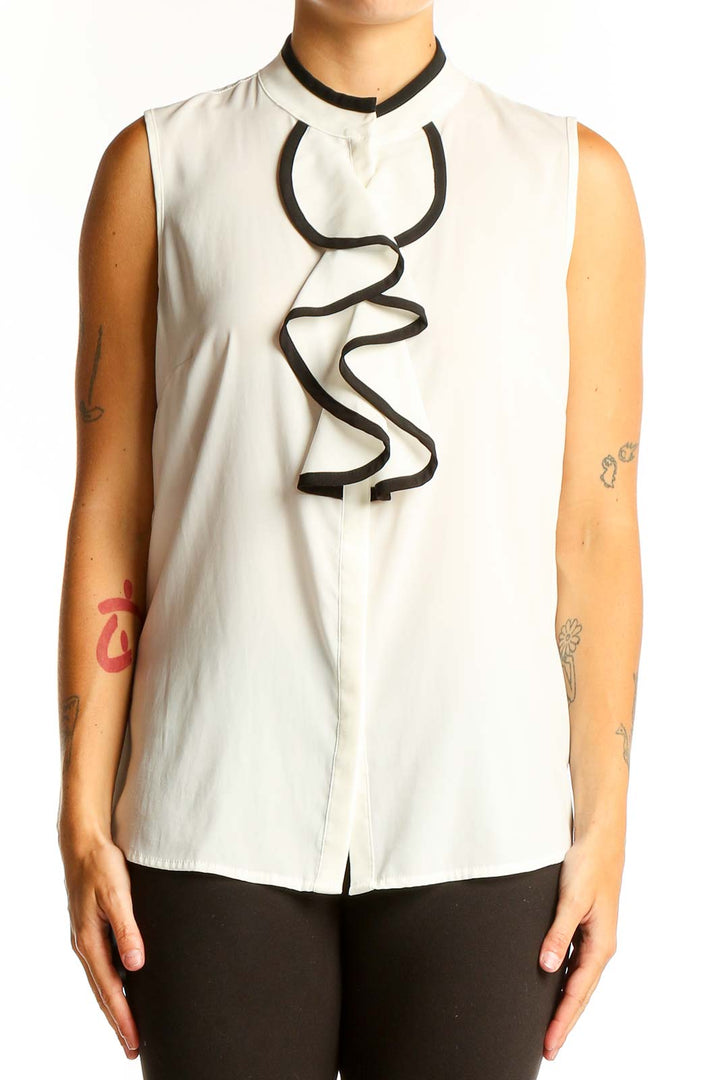 Front view of Calvin Klein white sleeveless blouse with black ruffle detail