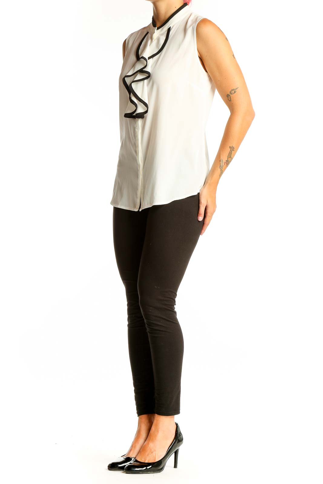 Front view of Calvin Klein white sleeveless blouse with black ruffle detail