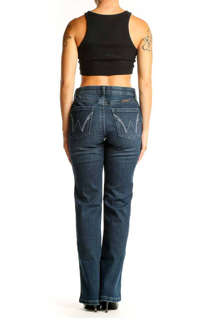 Back view of Wrangler dark blue bootcut jeans on model