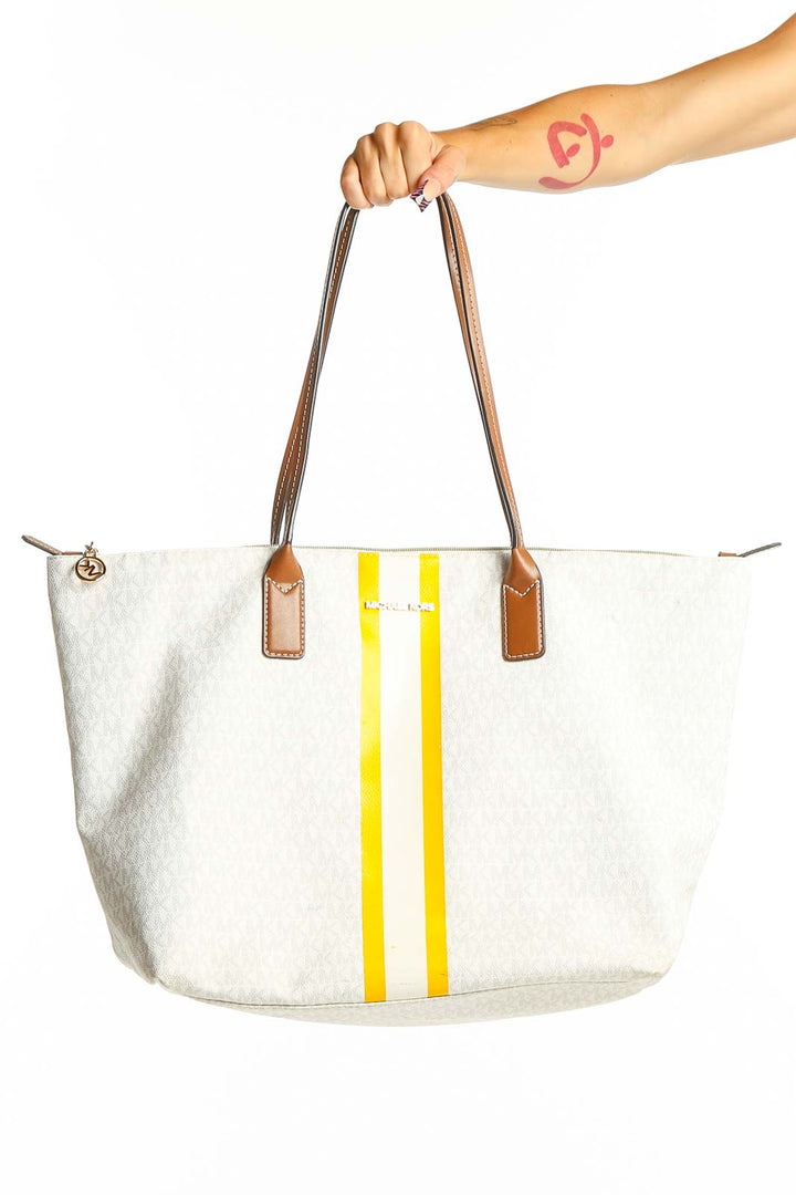 Front view of Michael Kors white tote bag with yellow stripes