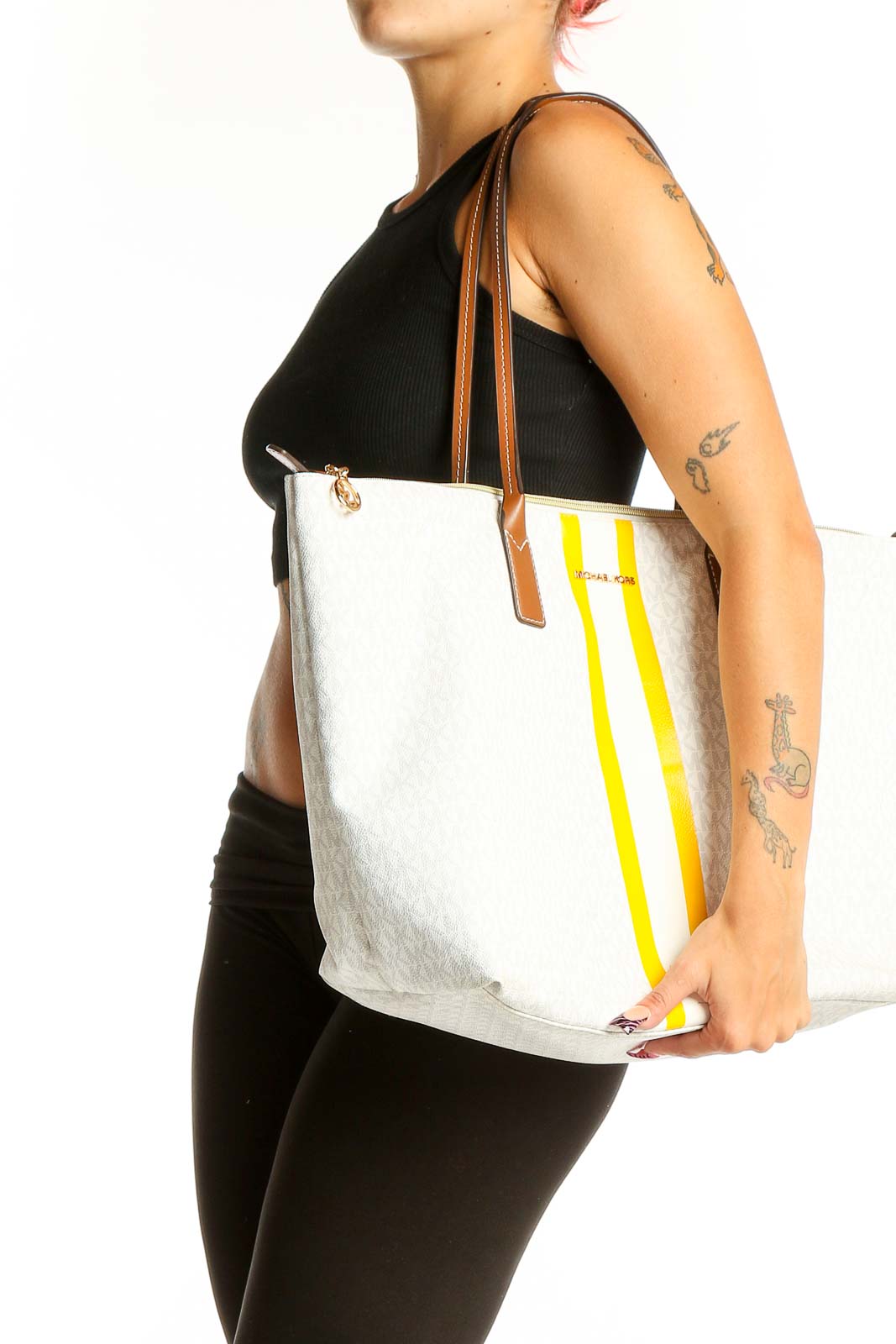 Front view of Michael Kors white tote bag with yellow stripes