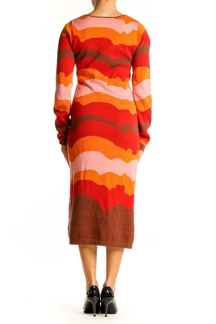 Side view of Another Girl Orange Wavy Striped Knit Midi Dress showing form-fitting silhouette