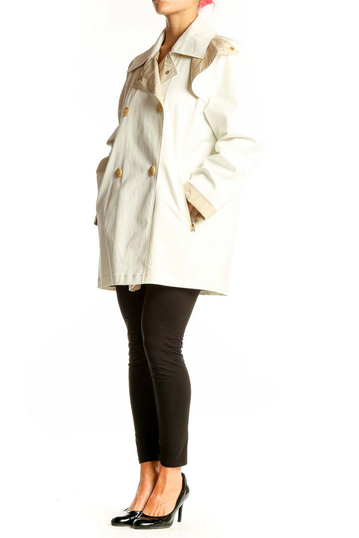 Front view of cream double-breasted coat by Weekend Max Mara