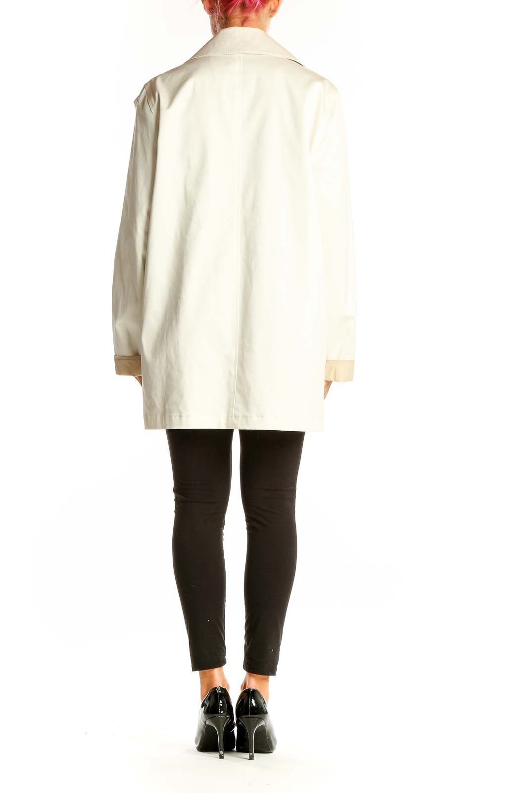 Side view of cream double-breasted coat by Weekend Max Mara on model