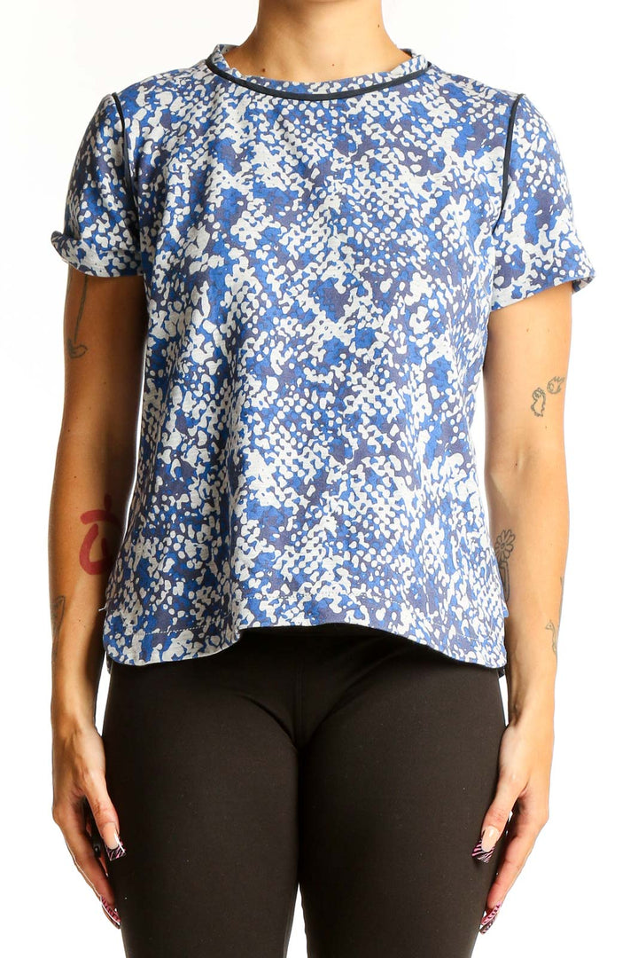 Front view of Club Monaco blue floral print short-sleeve top on model