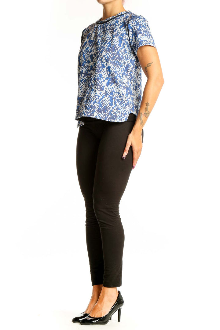 Front view of Club Monaco blue floral print short-sleeve top on model
