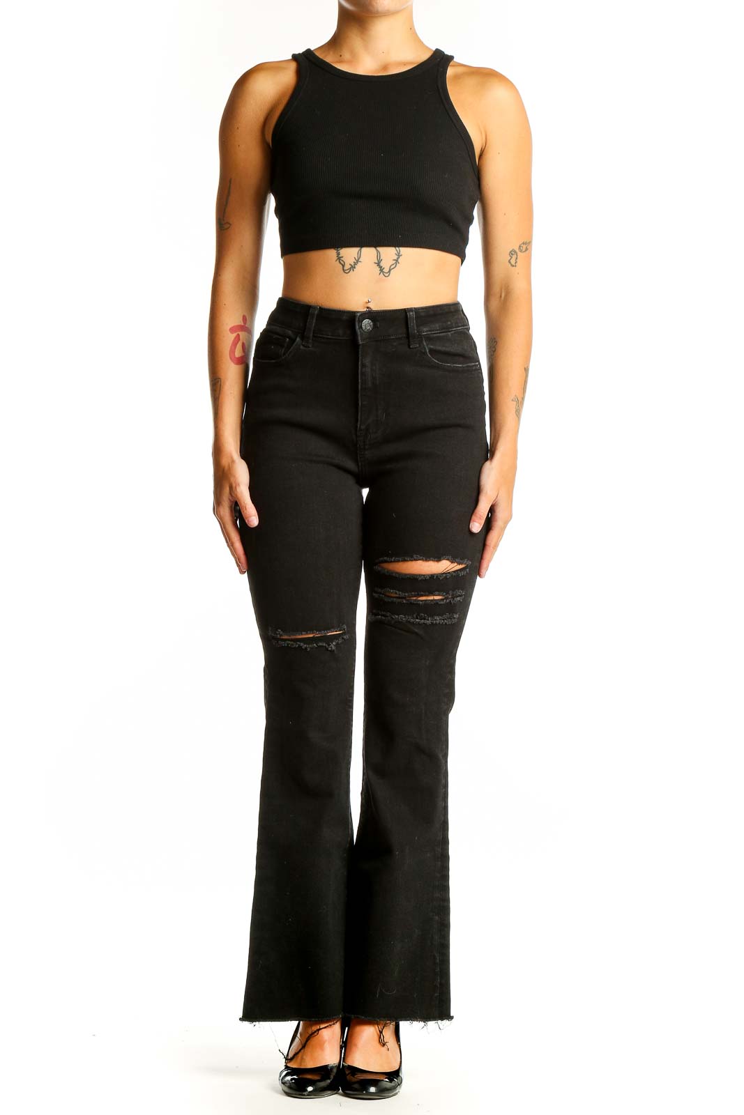 Front view of Guess black distressed flare jeans on model