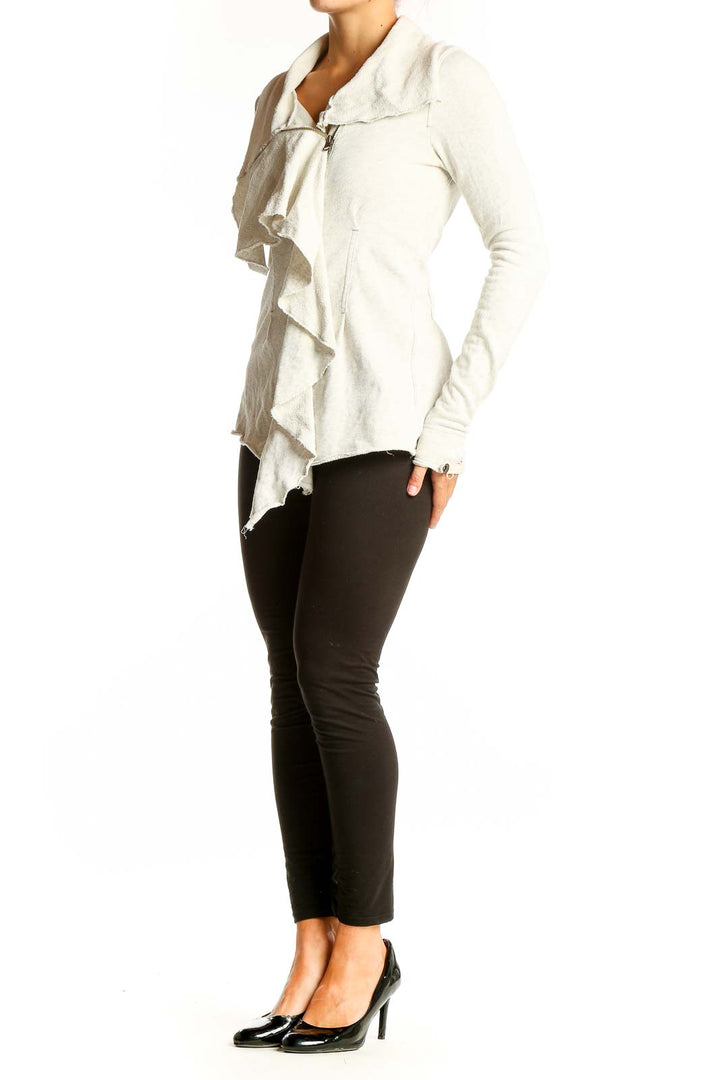 Front view of white ruffled cotton zip-up jacket from WE THE FREE