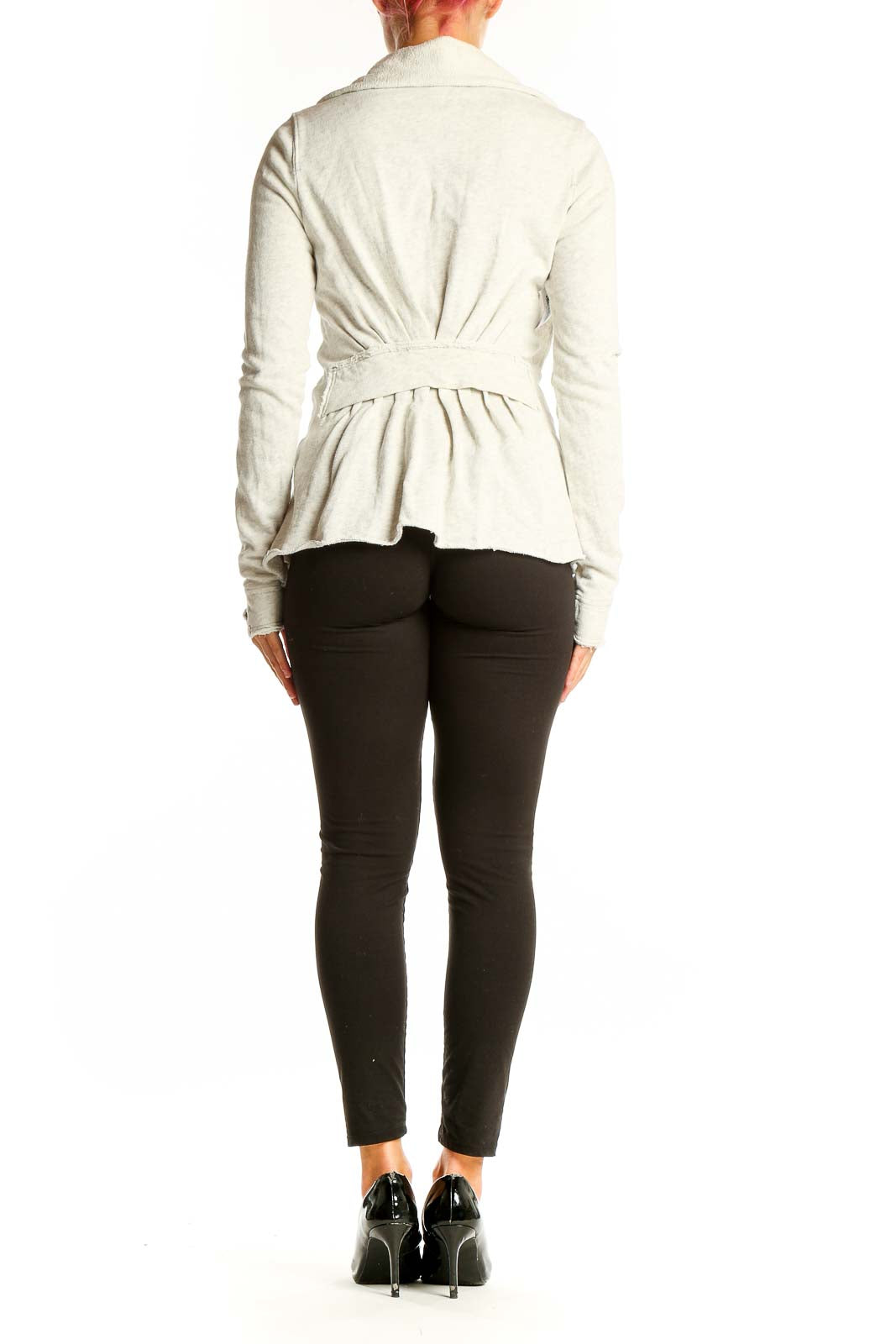 Side view of white ruffled cotton zip-up jacket from WE THE FREE on model