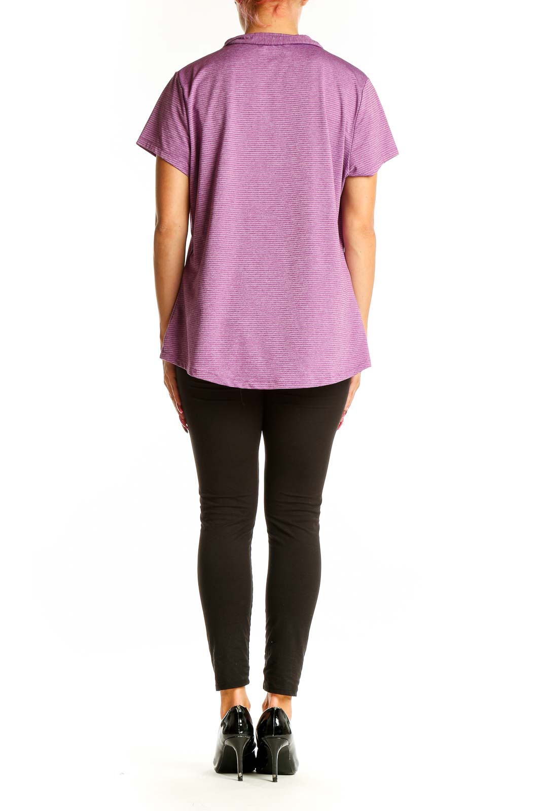 Side view of woman wearing purple striped Eddie Bauer polo shirt with black pants