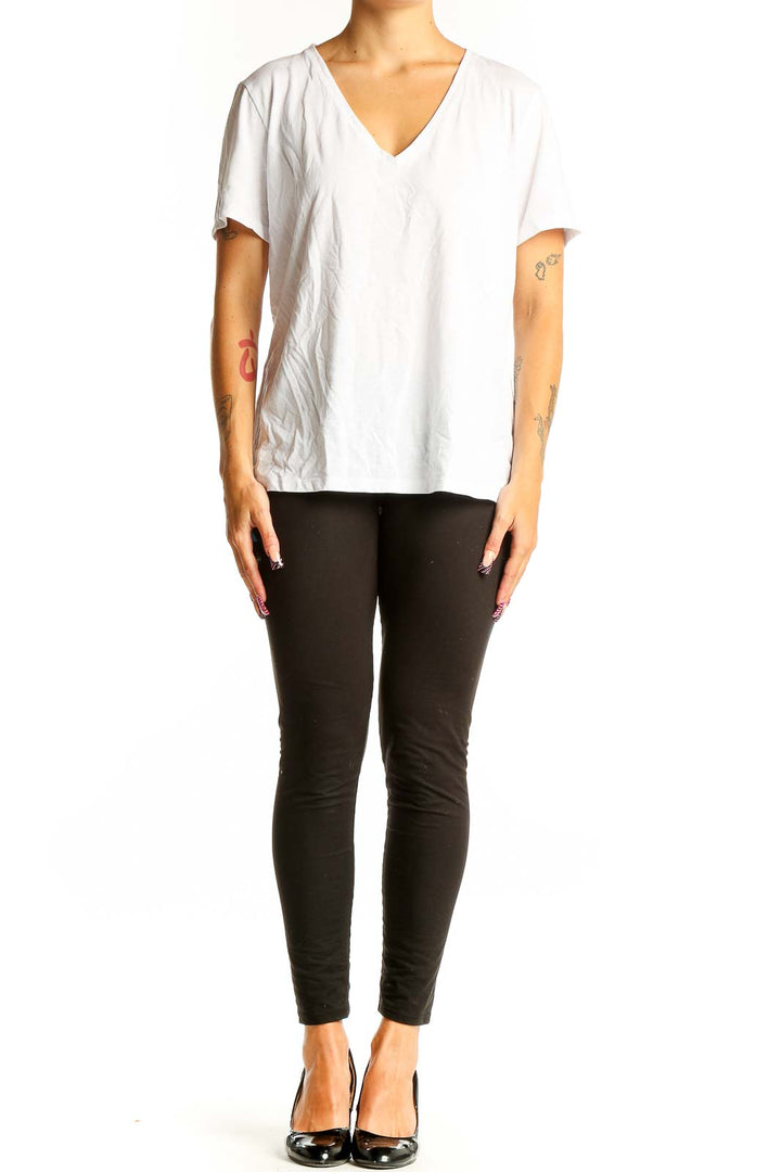 Front view of white Theory V-neck short sleeve top on model