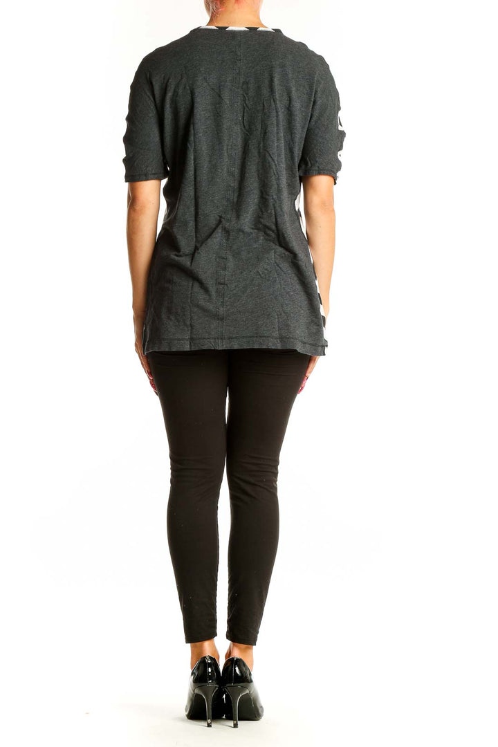 Back view of Lululemon black and white chevron print top on model